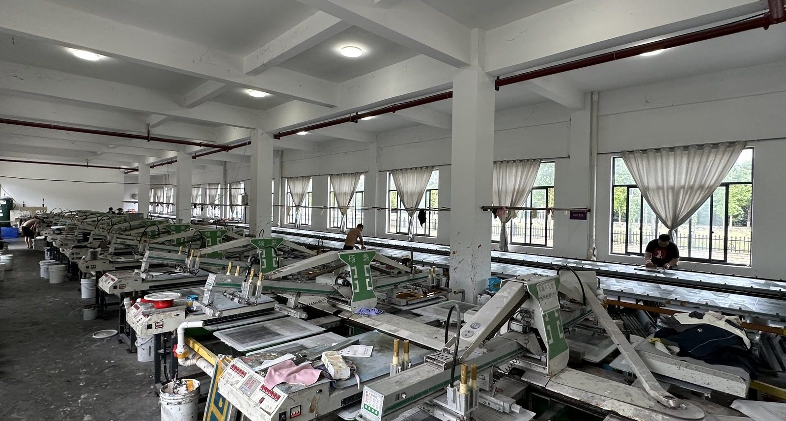 Wide view across the screen printing floor