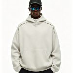 Bone heavyweight pullover hoodie worn by a model, front view