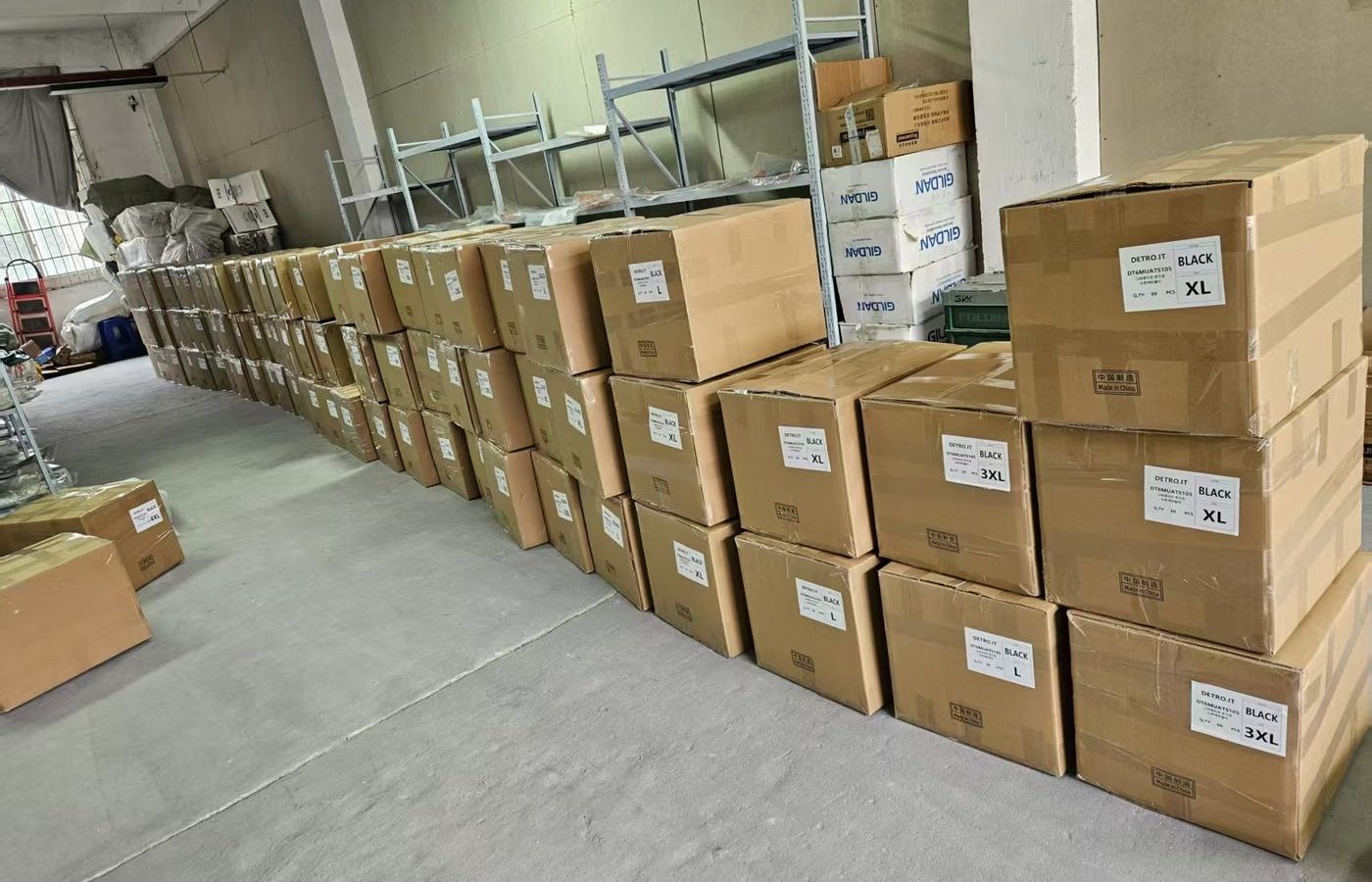 Stacked export cartons in the warehouse staging area