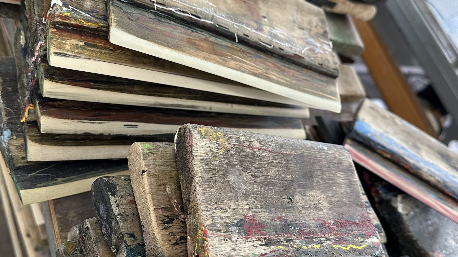 Stacked boards of fabric swatches from the in-house fabric library