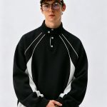 Black and white half-zip track jacket with contrast piping