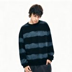 Navy striped knit sweater worn by a model