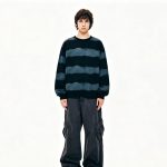 Full-length view of the striped knit sweater