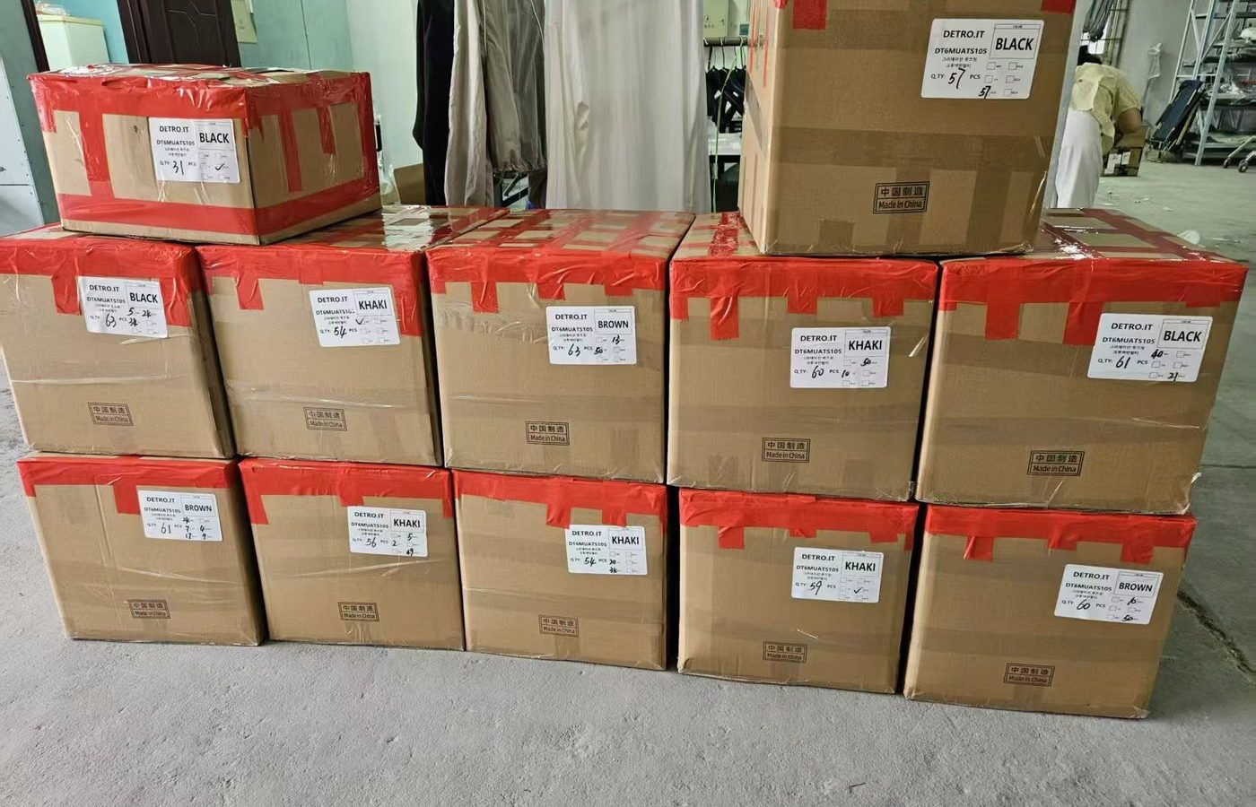 Export cartons sealed with EASTLEVEL tape and labelled for shipment