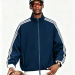 Model holding a ball in the retro track jacket