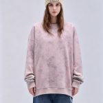 Rose washed fleece sweatshirt worn by a model