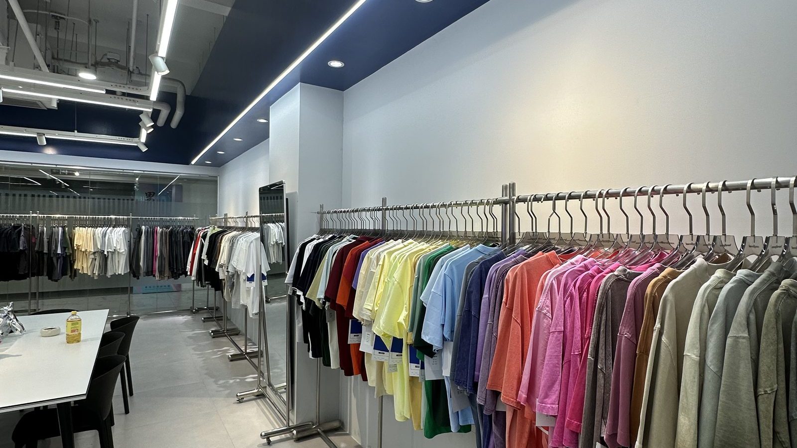 Row of finished samples hanging on a rail in the EASTLEVEL showroom