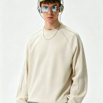 Cream raglan sweatshirt worn by a model, front view